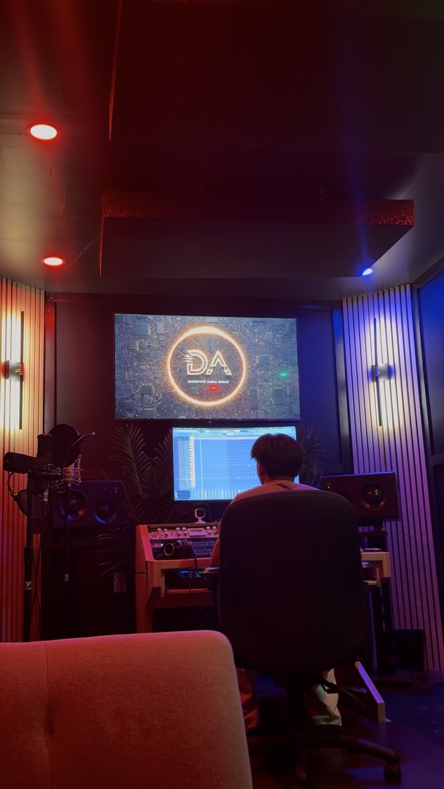 An engineer working at the mixing desk